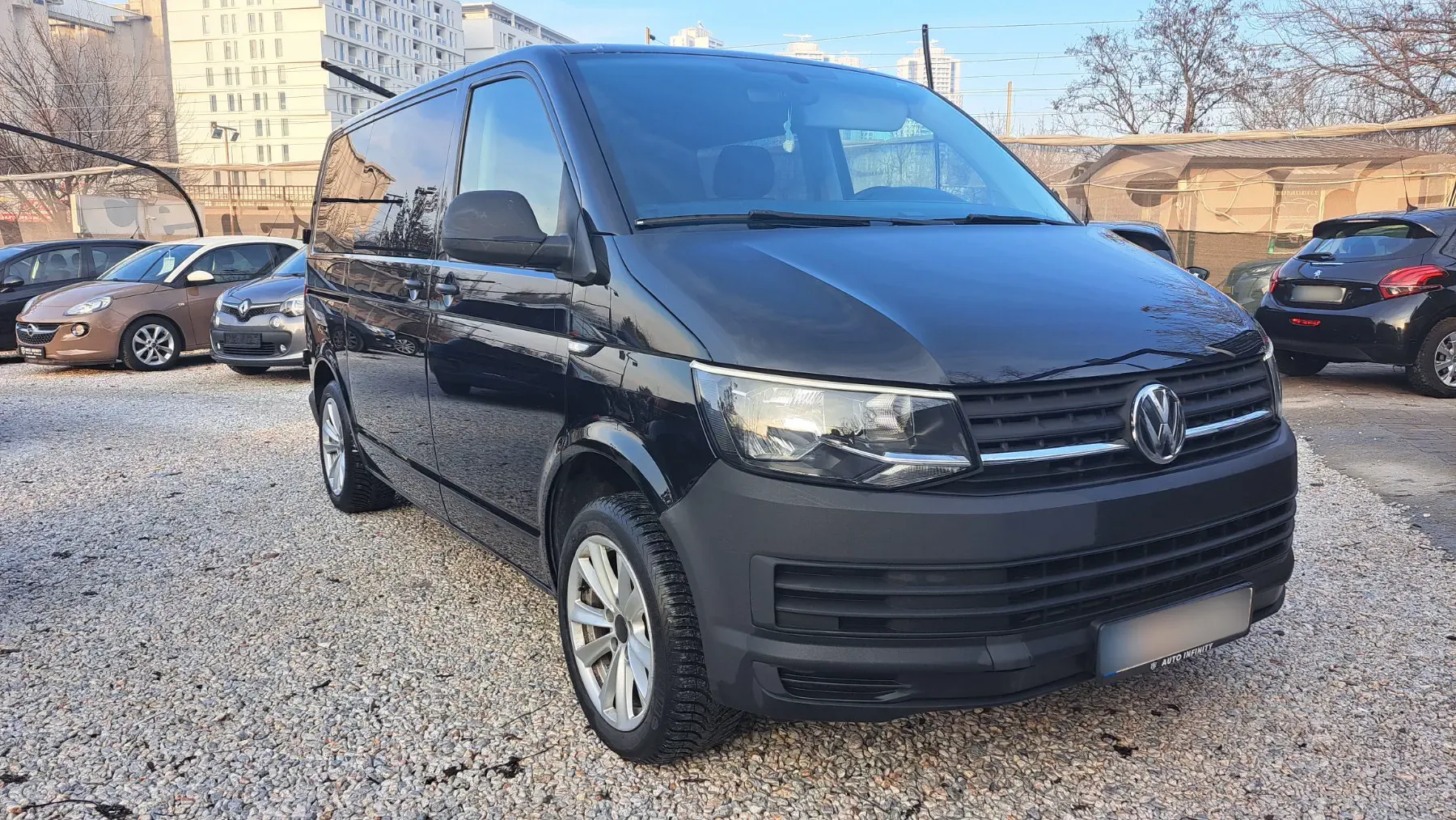 Black Volkswagen Caravelle van parked in Skopje
